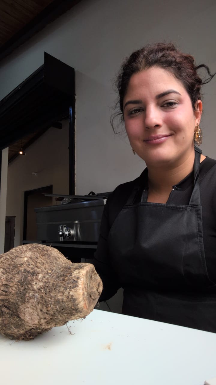 At El Quinto Sabor, with mountain produce in hand