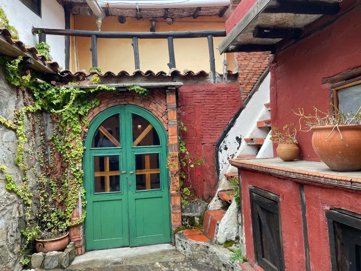 Terra's guesthouse, with its green door and courtyard